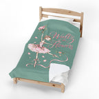 A single wooden bed with a mint green blanket featuring a ballerina illustration and the words 'Waltz of the Flowers' in pink script, shown on a white background.