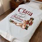 A white personalized bedding set, including a duvet cover and pillowcase, styled on a bed in a bedroom. The duvet cover features a custom printed design with the text 'Clara (noull) The original Christmas main character.