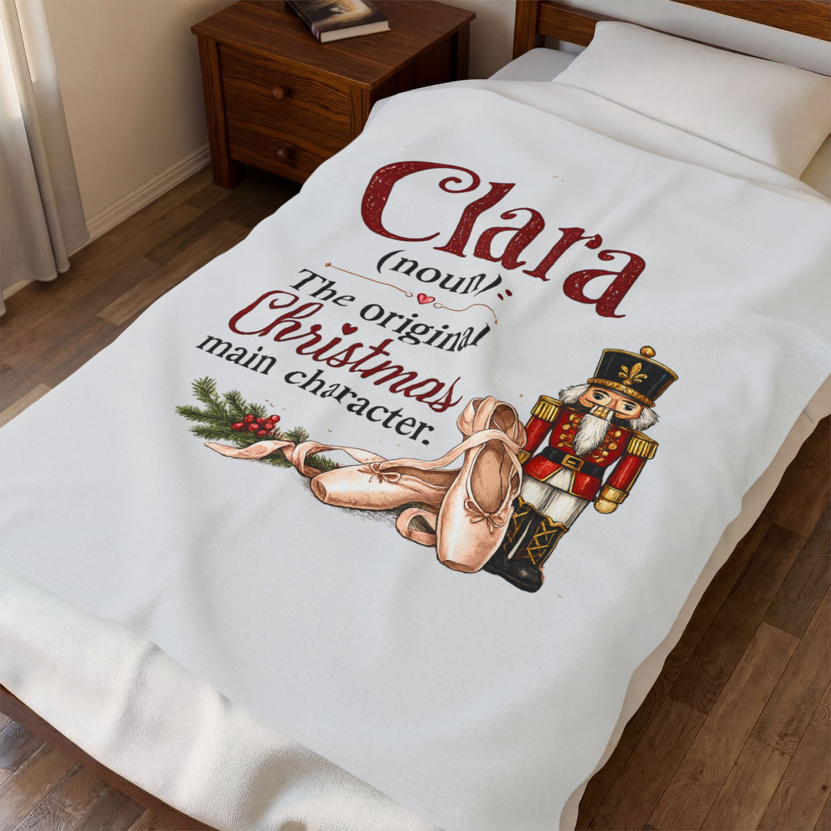 A white personalized bedding set, including a duvet cover and pillowcase, styled on a bed in a bedroom. The duvet cover features a custom printed design with the text 'Clara (noull) The original Christmas main character.