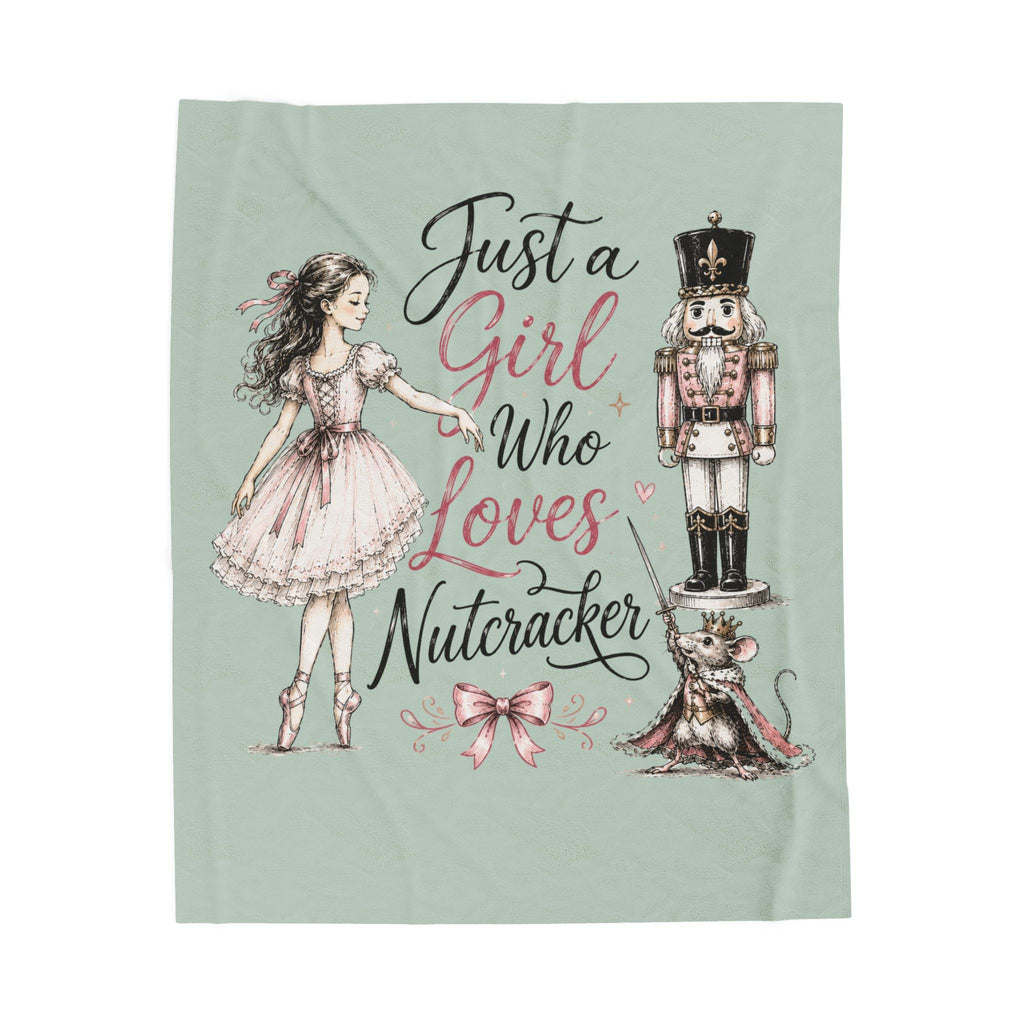 A square fabric throw blanket with a light sage green background, featuring a whimsical illustration of a girl in a pink dress pointing to a nutcracker and a mouse, with the text 'Just a Girl Who Loves Nutcracker' in black and pink script.