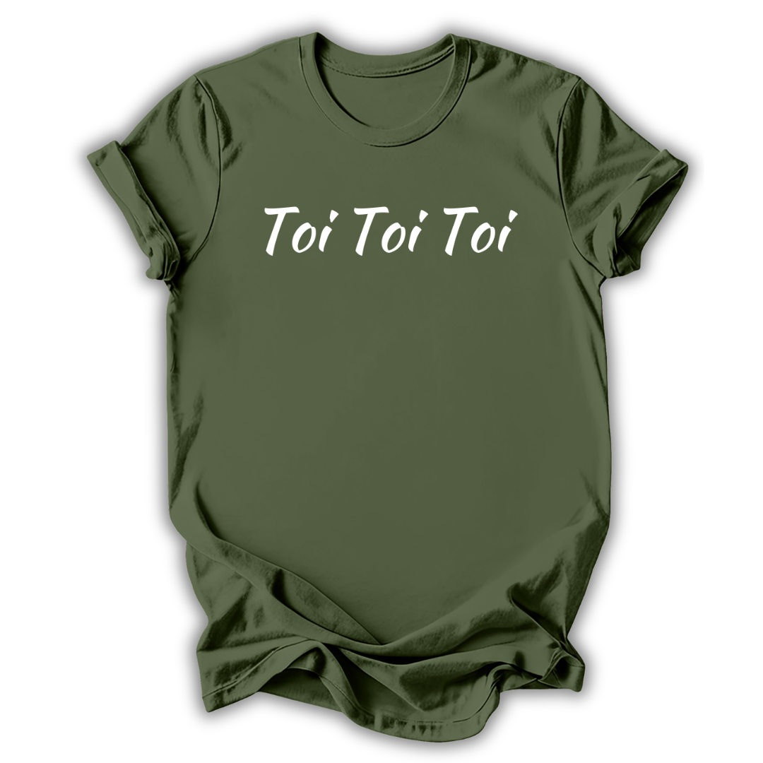 Green t-shirt with 'Toi Toi Toi' text on a white background