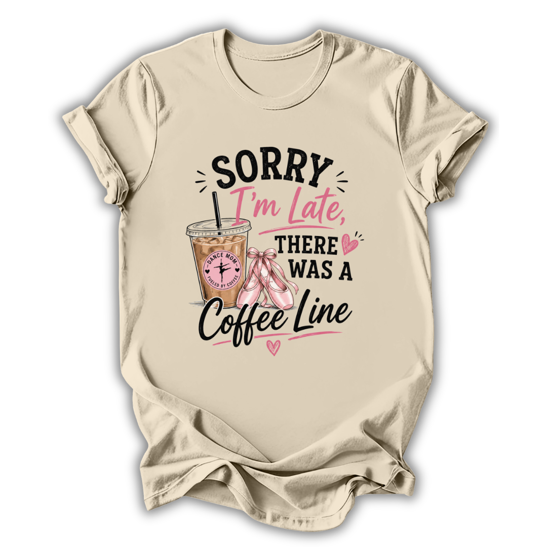 Beige t-shirt with a coffee-themed graphic and text on a white background