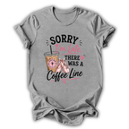 Gray t-shirt with a coffee cup graphic and text on a white background