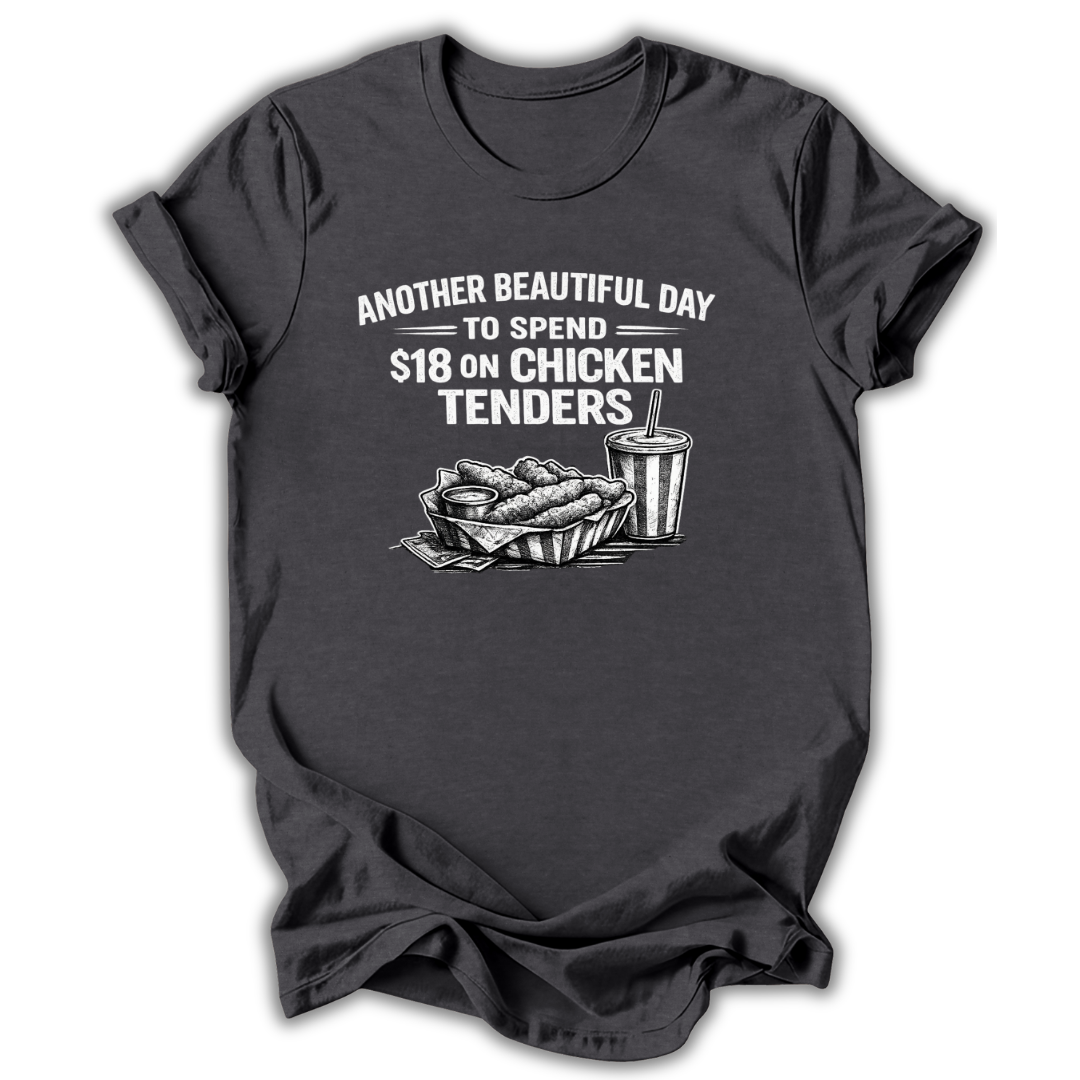 Dark t-shirt with graphic of chicken tenders and a drink, text 'Another Beautiful Day to spend $18 on Chicken Tenders' on a white background.