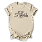 Beige t-shirt with text 'Every studio has a main character' on a white background
