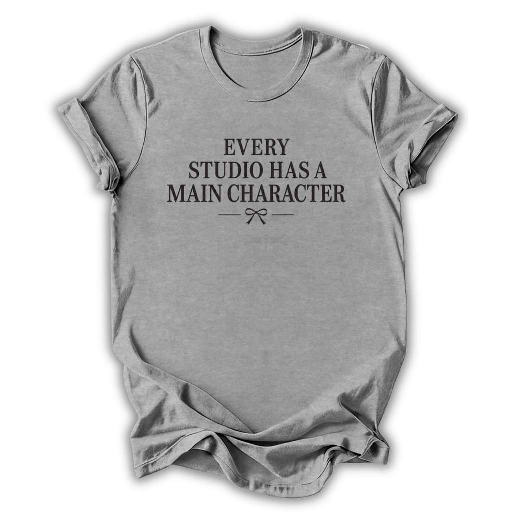 Gray t-shirt with black text 'Every Studio Has a Main Character' on a white background