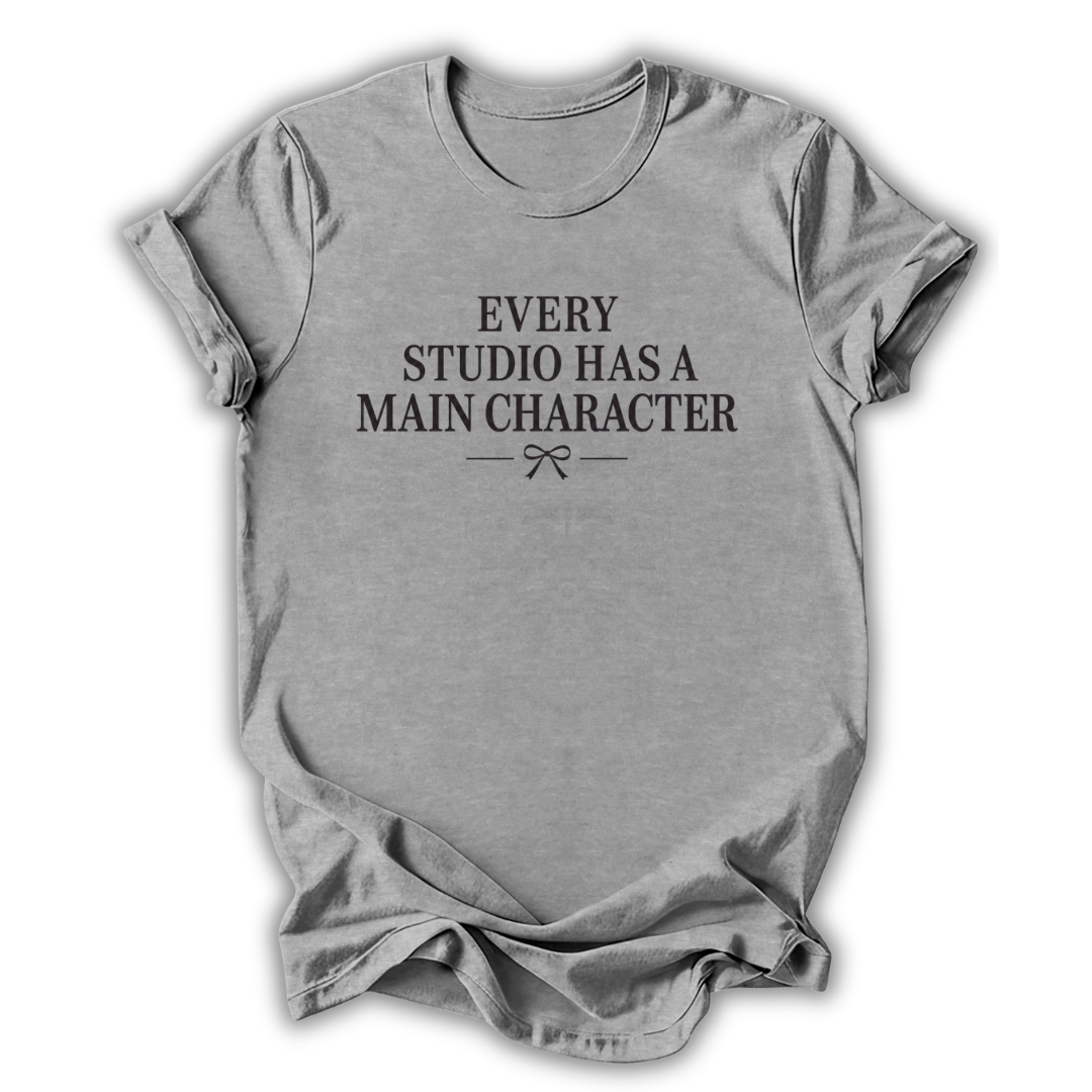 Gray t-shirt with black text 'Every Studio Has a Main Character' on a white background