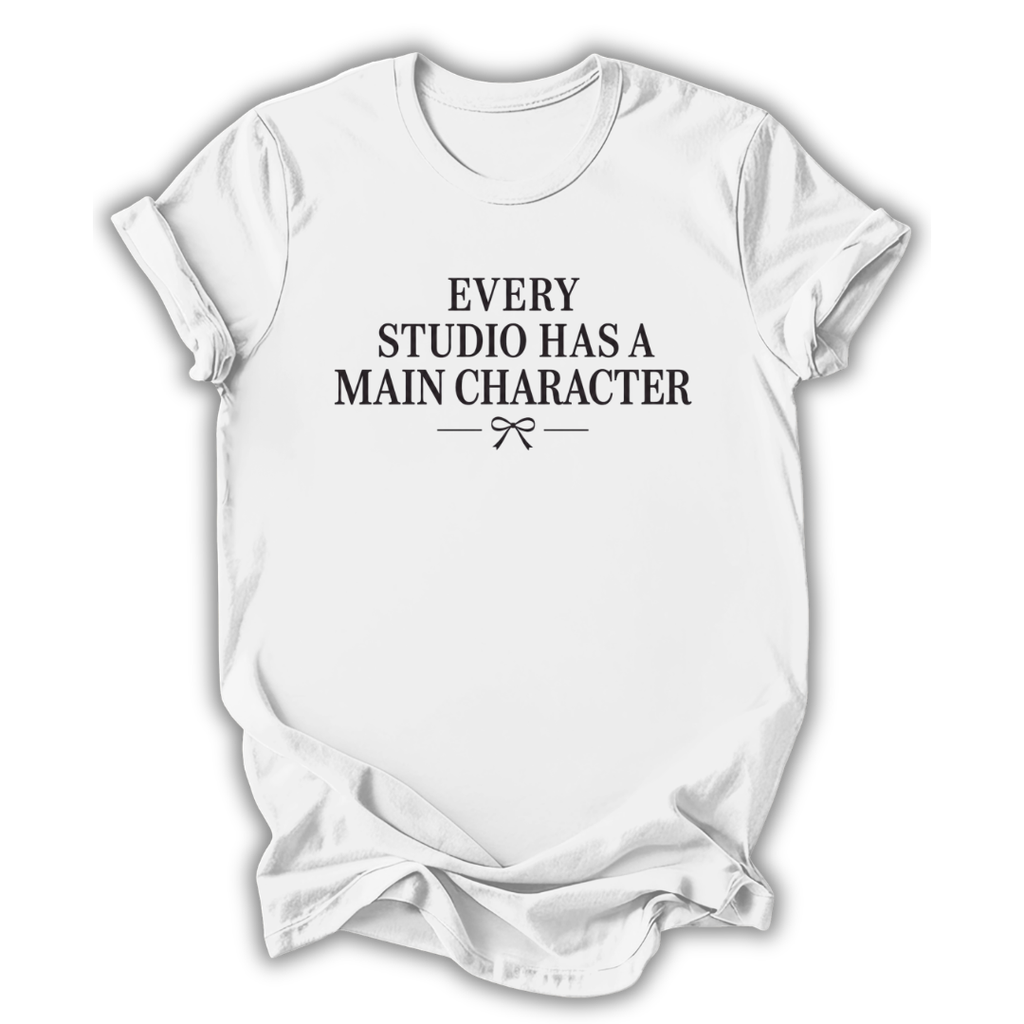 White t-shirt with black text 'Every Studio Has a Main Character' on a white background