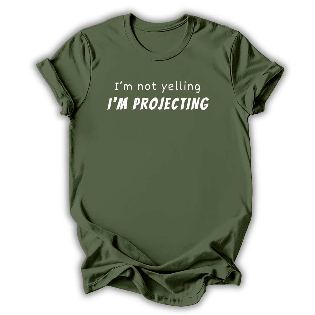 Green t-shirt with text 'I'm not yelling I'm projecting' on a white background