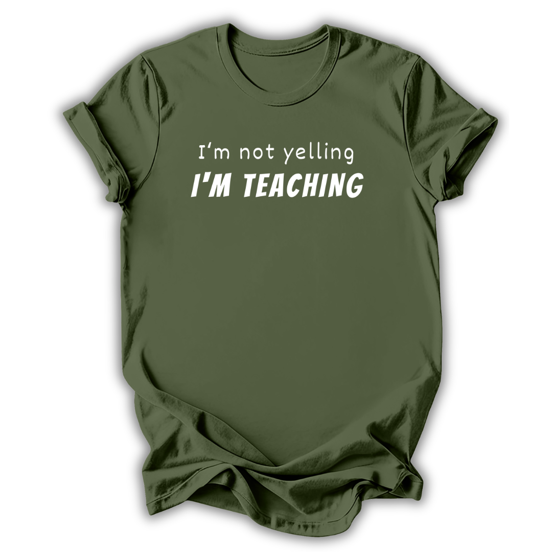 Green  t-shirt with 'I'm not yelling I'm Teaching' text on a white background