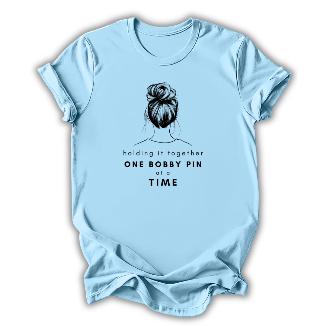 Light blue t-shirt with a graphic of a bun and text on a white background