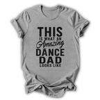 Gray t-shirt with black text 'This is what an amazing dance dad looks like' on a white background