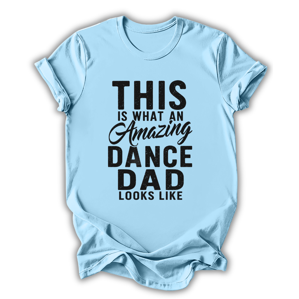 Light blue t-shirt with black text 'This is what an amazing dance dad looks like' on a white background