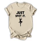 Beige t-shirt with 'Just Spot It' text and ballet dancer graphic on a white background