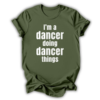 Green t-shirt with white text 'I'm a dancer doing dancer things' on a white background