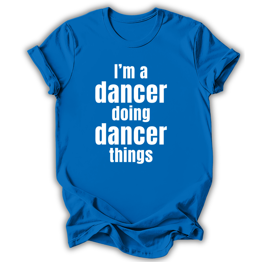 Blue t-shirt with white text 'I'm a dancer doing dancer things' on a white background