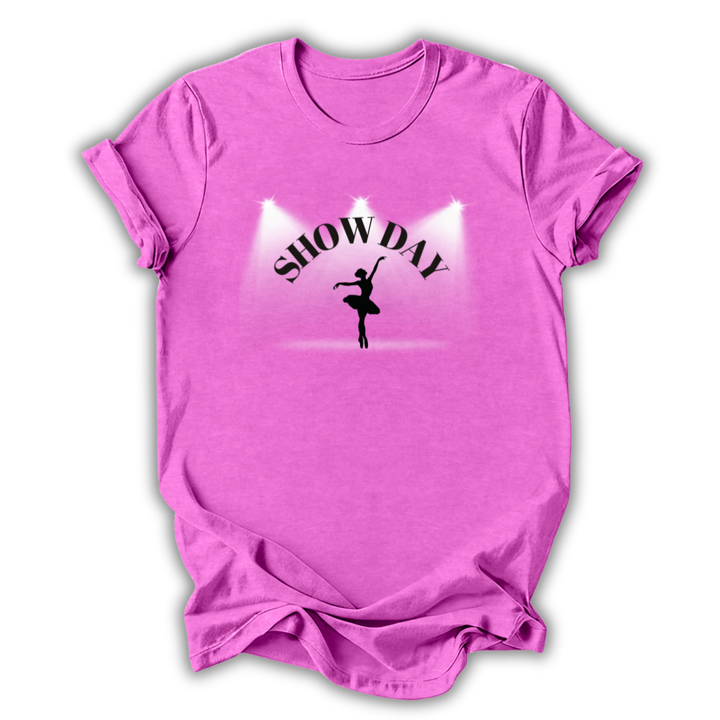 Pink t-shirt with 'SHOW DAY' and a dancer graphic on a white background