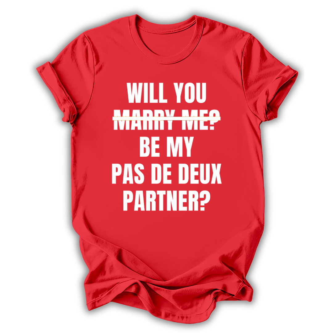 Red t-shirt with white text 'WILL YOU MARRY ME? BE MY PAS DE DEUX PARTNER?' on a white background