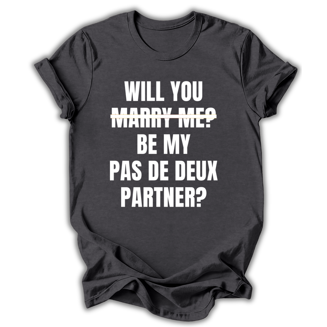 Navy t-shirt with white text 'WILL YOU MARRY ME? BE MY PAS DE DEUX PARTNER?' on a white background