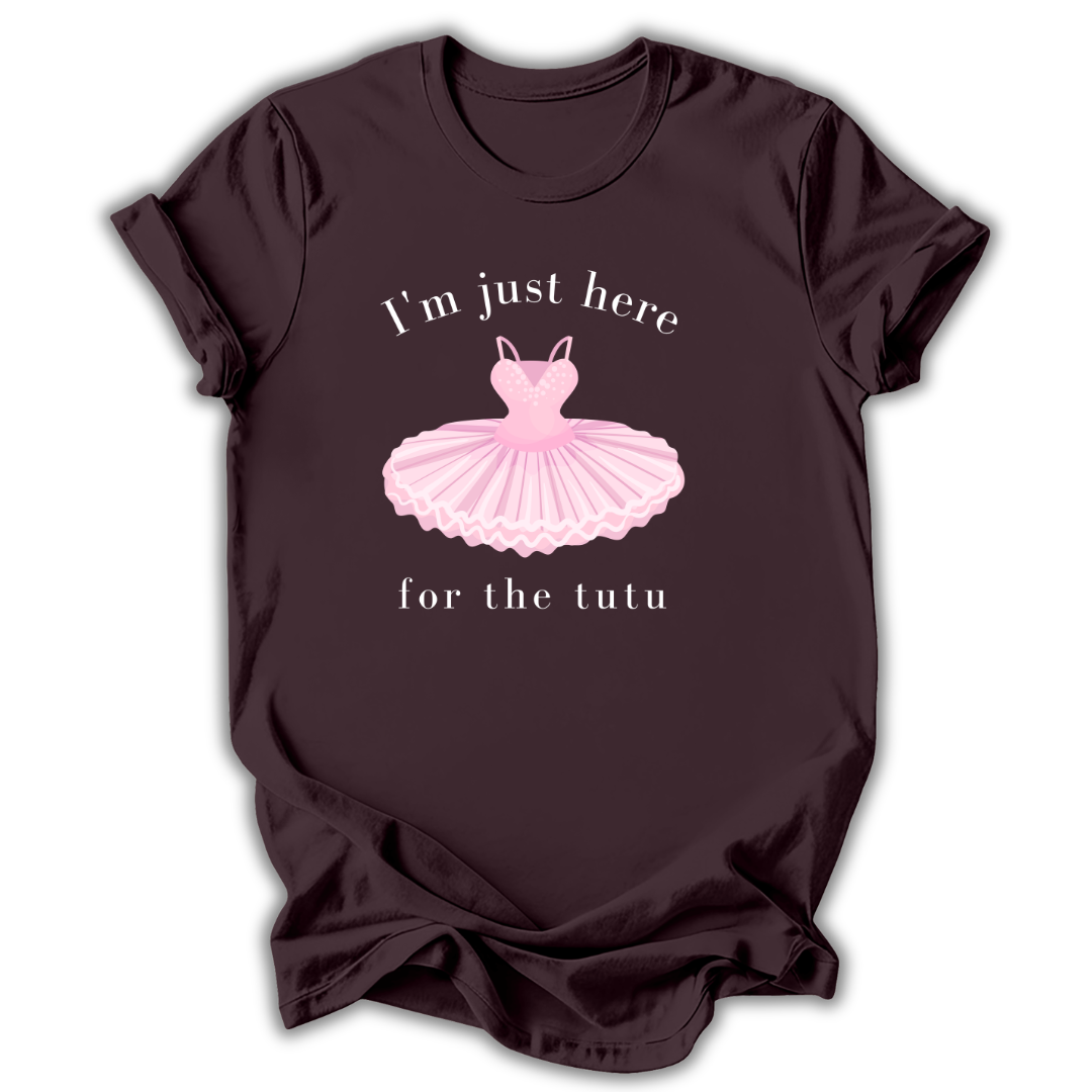 Brown t-shirt with pink ballet tutu graphic and text on a white background