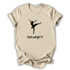 Beige t-shirt with a black silhouette of a dancer and 'Just Wingin' it' text on a white background