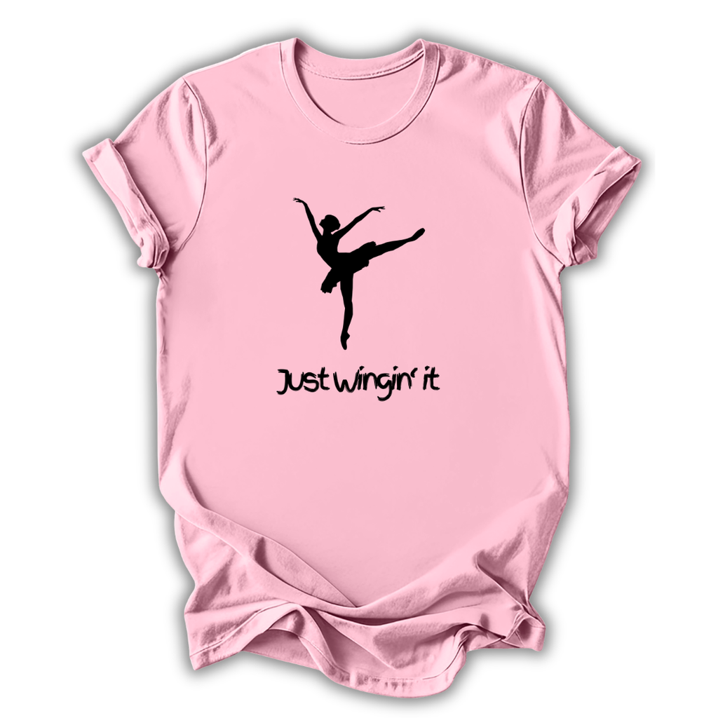 Pink t-shirt with a black silhouette of a dancer and 'Just Wingin' it' text on a white background