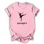 Pink t-shirt with a black silhouette of a dancer and 'Just Wingin' it' text on a white background