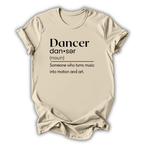 Beige t-shirt with black text definition of a dancer on a white background