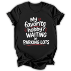 Black t-shirt with humorous text design on a white background