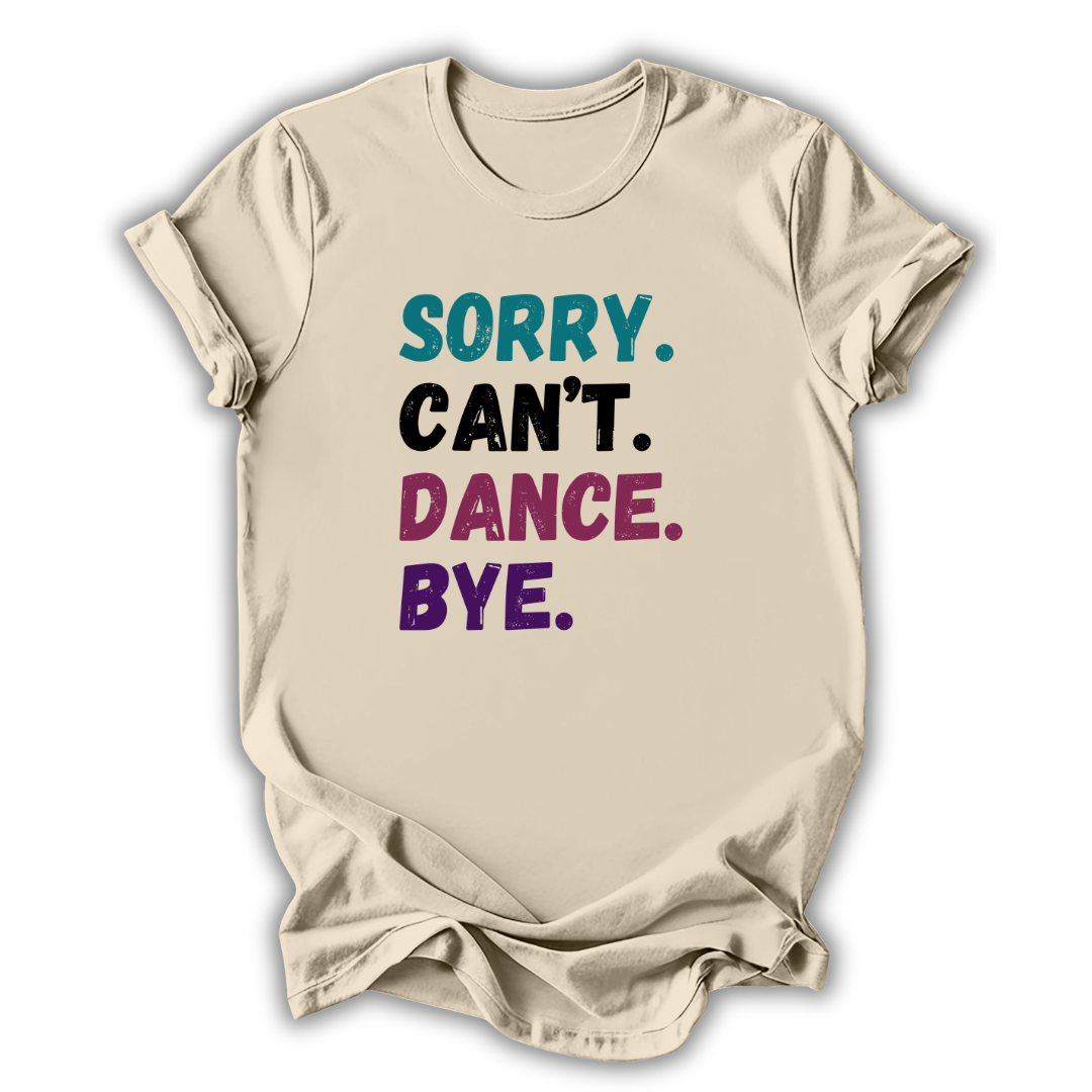 Beige t-shirt with colorful text 'Sorry. Can't. Dance. Bye.' on a white background