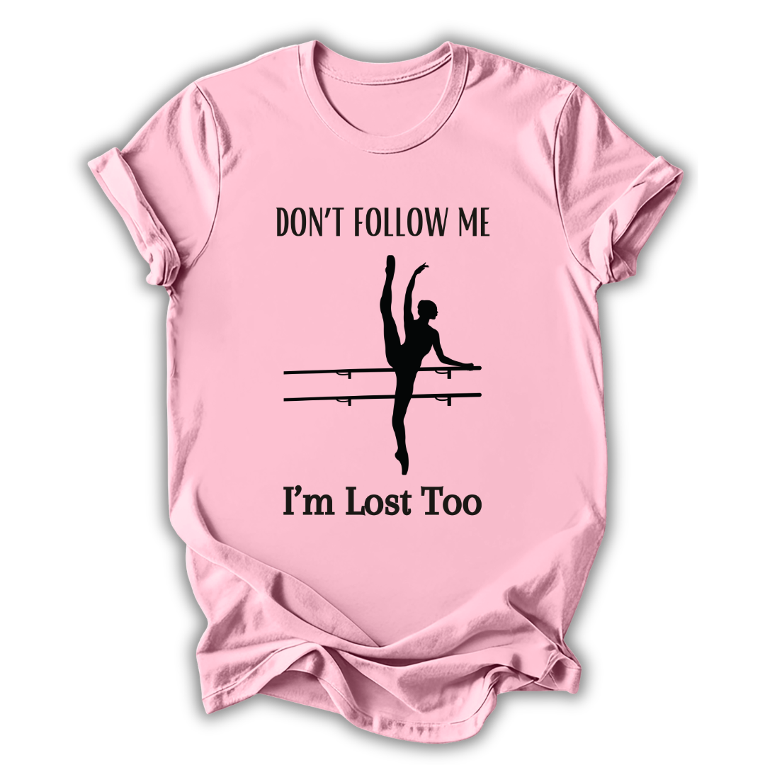 Pink t-shirt with a graphic of a dancer and text 'Don't follow me, I'm lost too' on a white background