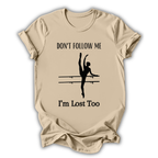 Beige t-shirt with a graphic of a dancer and text 'Don't follow me, I'm lost too' on a white background
