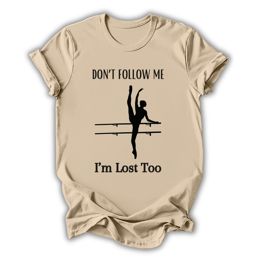 Beige t-shirt with a graphic of a dancer and text 'Don't follow me, I'm lost too' on a white background