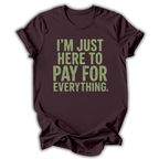 Brown t-shirt with green text 'I'm just here to pay for everything' on a white background
