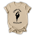 Beige t-shirt with 'Check Your Attitude' text and graphic on a white background