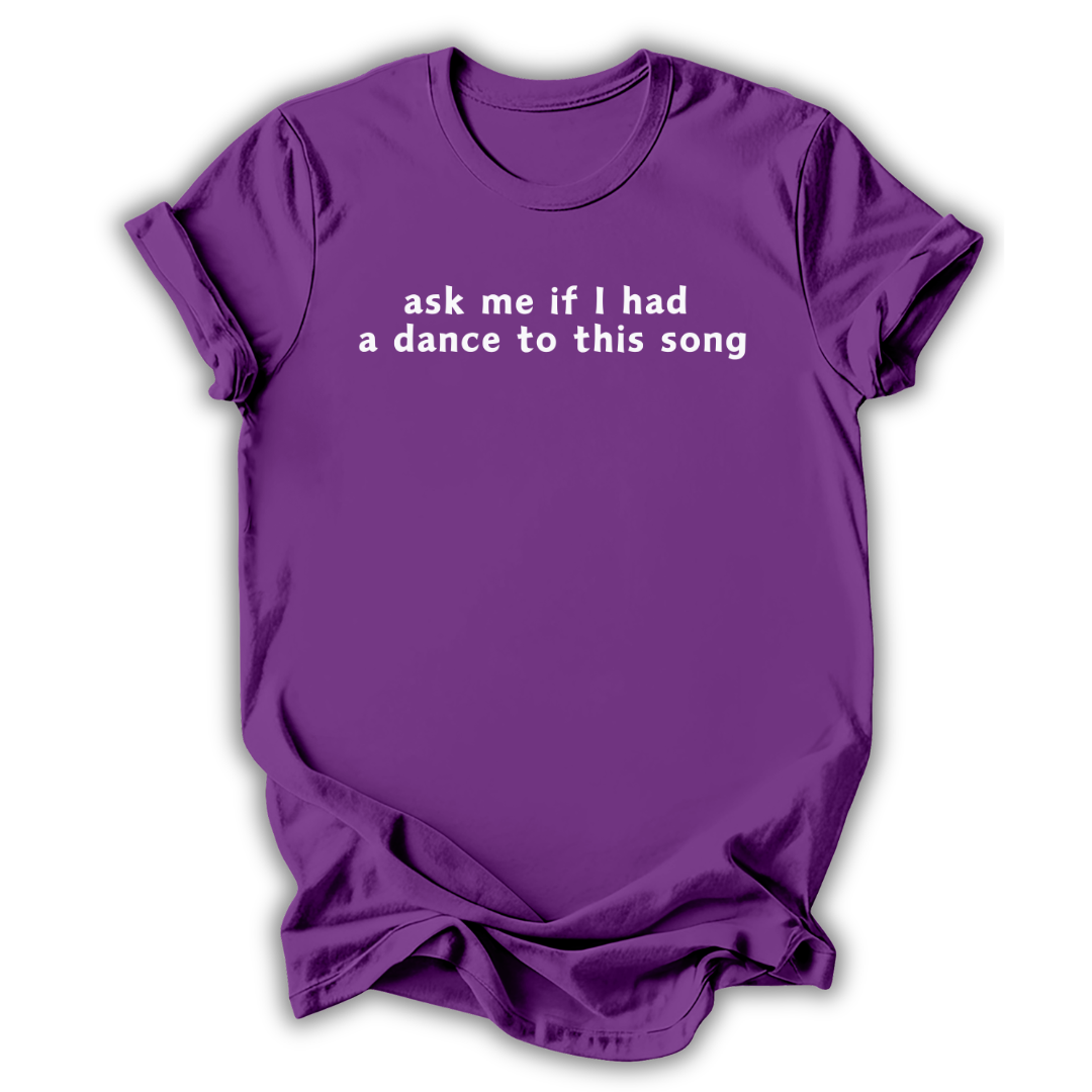 Purple t-shirt with text 'ask me if I had a dance to this song' on a white background