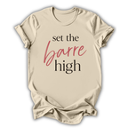 Beige t-shirt with 'set the barre high' text on a white background