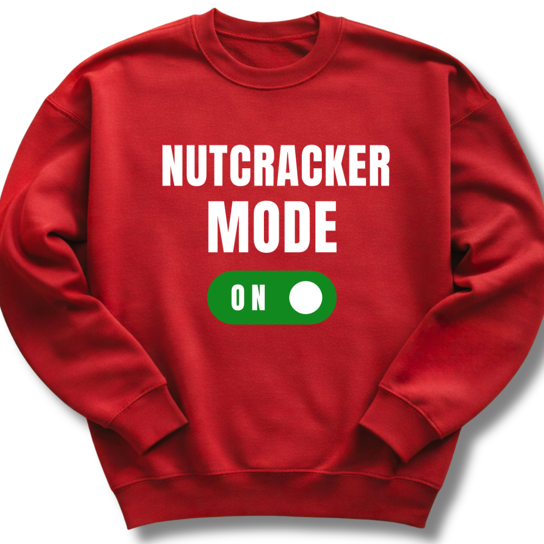 Red sweatshirt with 'NUTCRACKER MODE ON' text and green toggle button on a white background