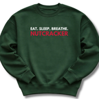 Green sweatshirt with 'Eat. Sleep. Breathe. Nutcracker' text on a white background