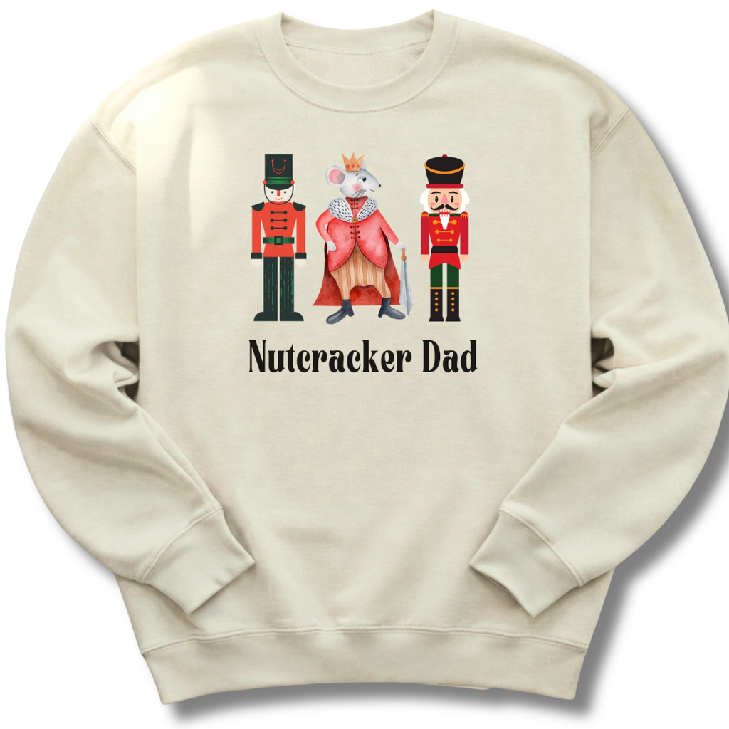 Beige sweatshirt with Nutcracker-themed design and 'Nutcracker Dad' text on a white background