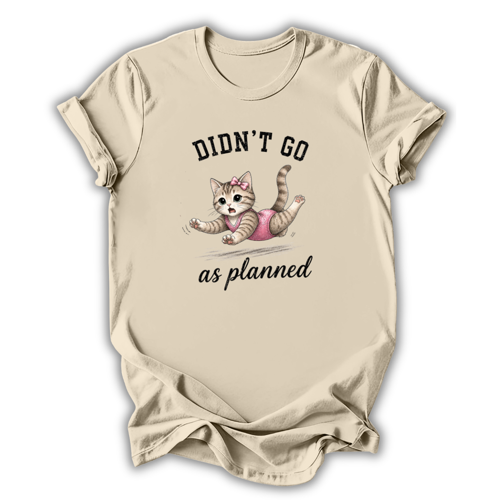 Beige t-shirt with a graphic of a cat and text 'Didn't go as planned' on a white background