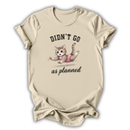 Beige t-shirt with a graphic of a cat and text 'Didn't go as planned' on a white background