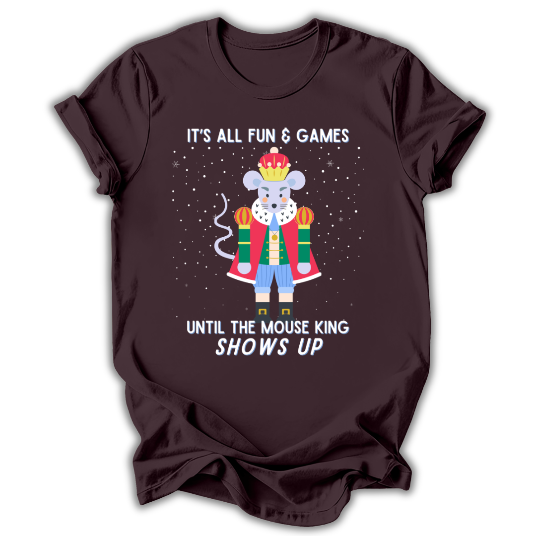 A dark brown short-sleeve t-shirt with a graphic of a cartoon mouse dressed as a king in a red robe and blue pants, surrounded by white text that reads 'IT'S ALL FUN & GAMES UNTIL THE MOUSE KING SHOWS UP' on a white background.