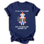 A navy blue short-sleeve t-shirt with a graphic of a mouse dressed as a king in a red robe and crown, surrounded by white text that reads 'IT'S ALL FUN & GAMES UNTIL THE MOUSE KING SHOWS UP' on a white background.