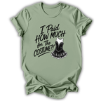 A sage green short-sleeve t-shirt with a black graphic text print reading 'I Paid HOW MUCH for The COSTUME!!' next to an illustration of a black sequined costume dress, displayed on a clean white background.