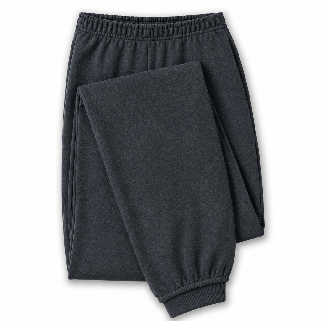 Dark charcoal gray jogger pants with an elastic waistband and ribbed ankle cuffs, shown folded on a white background.
