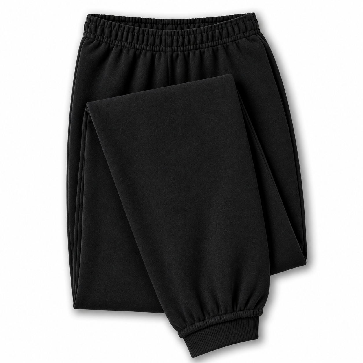 Black jogger sweatpants with an elastic waistband and ribbed ankle cuffs, shown folded on a white background.
