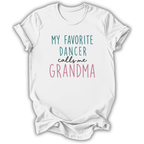 A white short-sleeve crewneck t-shirt with a graphic text print reading 'MY FAVORITE DANCER calls me GRANDMA' in teal, black, and pink lettering, displayed on a clean white background.