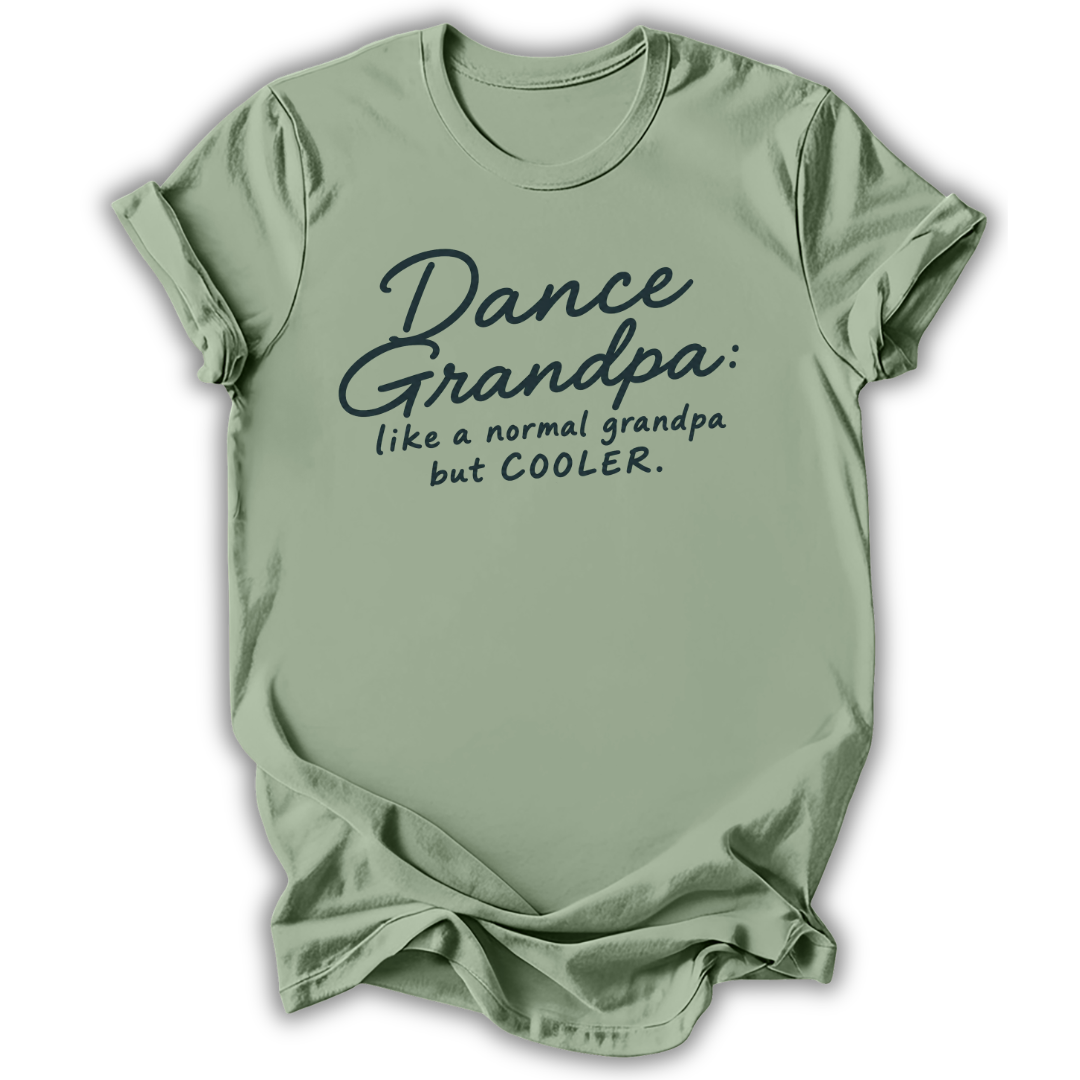 A sage green short-sleeve t-shirt with a dark teal graphic text print that reads 'Dance Grandpa: like a normal grandpa but COOLER.' on a white background.