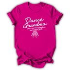 A bright pink short-sleeve t-shirt with a white graphic print that reads 'Dance Grandma: like a normal grandma but COOLER.' with a small ballet shoe illustration, shown on a plain white background.